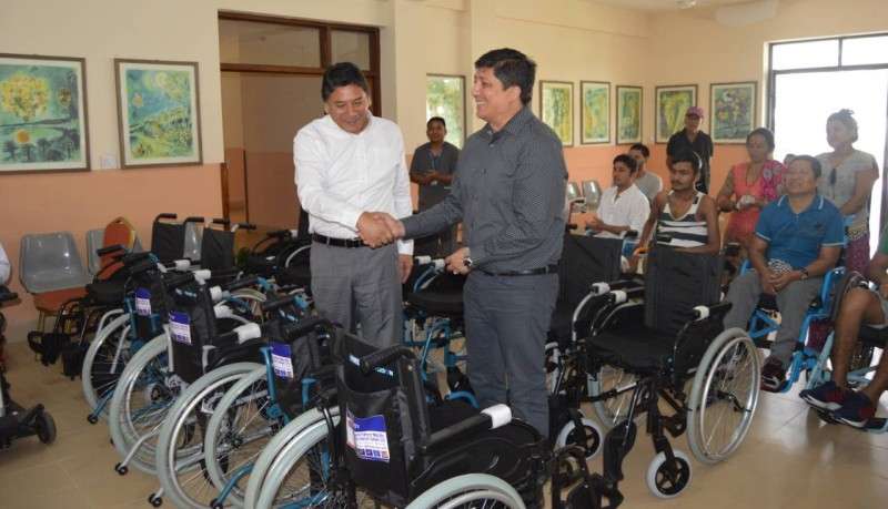 NIBL hands over wheelchairs to SIRC