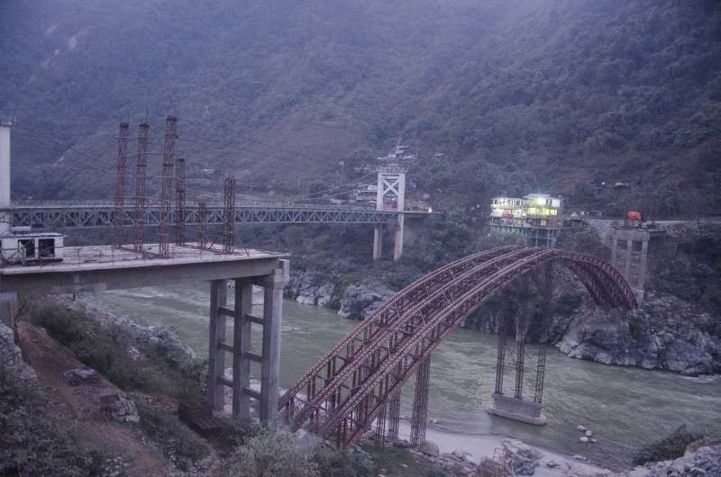 A new bridge being built over the Trishuli River in Mugling after the existing bridge started wearing out. The new bridge was supposed to be complete by October 17 as per the contract but only 50 percent of the construction work has been complete so far. Photo: Sagar Basnet/Aarthik Abhiyan
