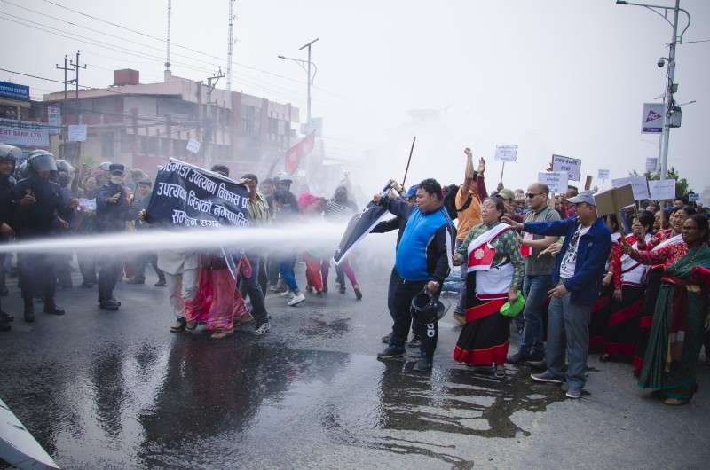 Police spray water canon on people protesting against the road expansion drive of the government. The protesters hit the streets on Wednesday after the government demolished their houses in the process of constructing Outer Ring Road and Kathmandu-Tarai Fast Track but has not given them compensation or relocated them. Photo: Sagar Basnet/NBA