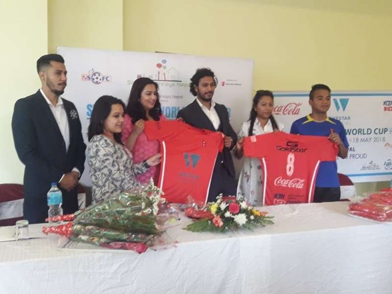 This handout photos shows sponsors handing over jerseys to children participating in the Street Child World Cup 2018 in Russia from May 10 to 18. 
