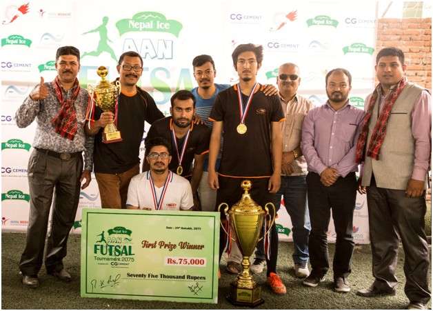 Members of Outreach Nepal pose for a group photo after winning the title of Nepal Ice AAN Futsal Tournament on Saturday.