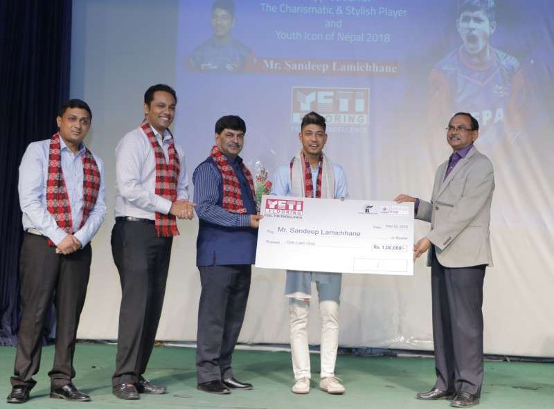 Yeti Carpet and DAV College jointly handing over a cheque of Rs 100,000 to cricketer Sandeep Lamichhane on Wednesday for his exceptional performance in the Indian Premier League. He returned from India on Tuesday after featuring in his maiden IPL. Photo: Saroj Karki/NBA