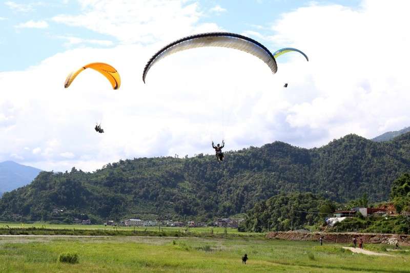 Paragliders about to land in Pame of Pokhara in this recent photo. The Ministry of Tourism and Civil Aviation has issued a circular to all paragliding companies to adopt adequate safety measures while operating their business. Photo: Narahari Poudyal/NBA