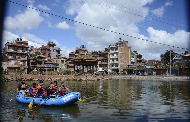 Locals of Pimbhal in Lalitpur enjoying rafting at a local pond. The rafting was organised to raise awareness about preserving the cultural heritage and infrastructure of the area. Photo: Ravi Maharjan/NBA