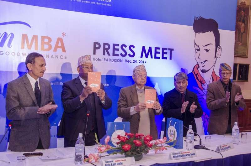 Representatives of Goodwill Finance unveiling a book IM MBA in the capital on Sunday. Photo: Sagar Basnet/Aarthik Abhiyan