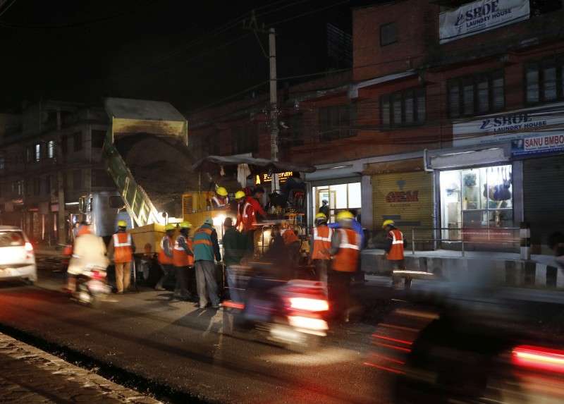 Workers constructing road during night time at Maharajgunj. Photo: Pradip Luitel/Aarthik Abhiyan