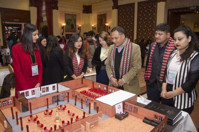 Nepal Electricity Authority CEO Kulman Ghising inspecting interior designs created by students of IEC College. Photo: Sagar Basnet/Aarthik Abhiyan
