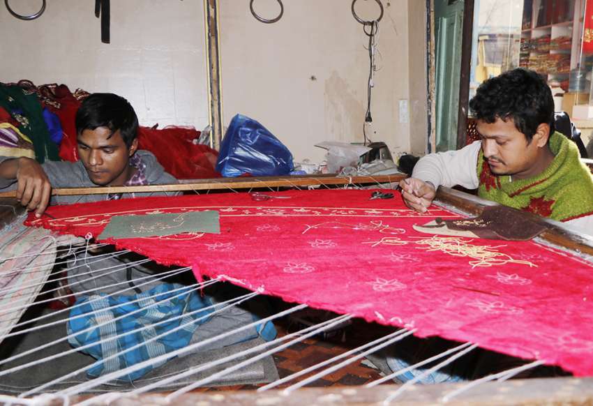 Workers working at a boutique in New Road. Photo: Pradip Luitel/Aarthik Abhiyan