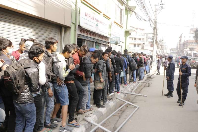 Youths queue in line at Panipokhari-based embassy of the UAE to verify their character certificate on Sunday. A large number of Nepali youths aspire for foreign employment in the Gulf country. Photo: Pradip Luitel/NBA