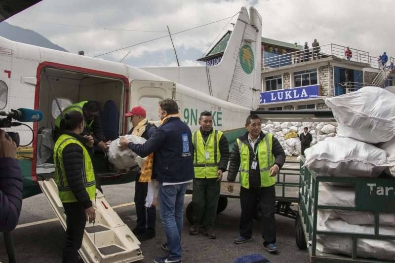 This handout photo provided by Yeti Airlines shows the company’s representatives loading trash into the plane at Lukla during the Sagarmatha Cleanup Campaign initiated by the airline. The airlines began airlifting 100-ton non-biodegradable garbage from the area to recycle it in Kathmandu valley.