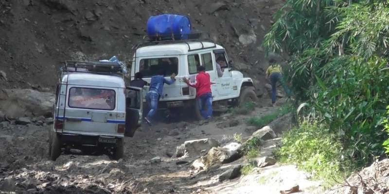 Locals of Panchthar pushing vehicles stuck in a muddy road in this recent photo. The people of this region have volunteered to mend the roads keeping in mind flow of vehicles during the  Dashain festival. Photo: Khabin Luitel/NBA