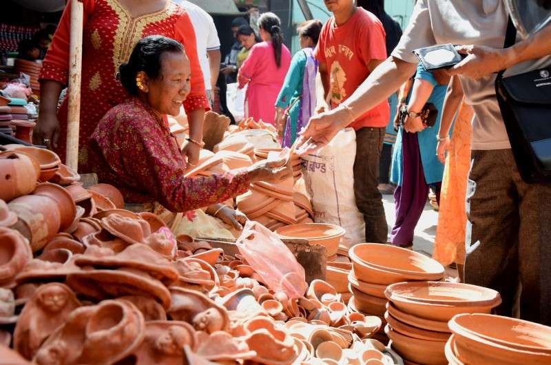 People buying vessels at Asan on Tuesday to plant seeds of ‘jamara’ on Ghatasthapana or the first day of the Dashain festival. The vendors are selling vessels ranging from Rs 200 to Rs 650. Photo: Monika Malla/NBA