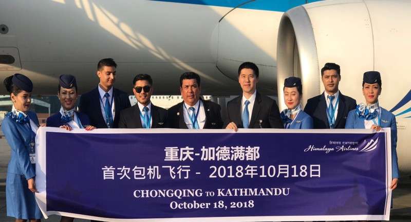 Crew members of Himalaya Airlines during the company’s inaugural flight to Chongqing, a major tourist city in China.  The airline company said that it has started operating direct chartered flights to Chongqing from Kathmandu every Thursday. Photo Courtesy: Himalaya Airlines
