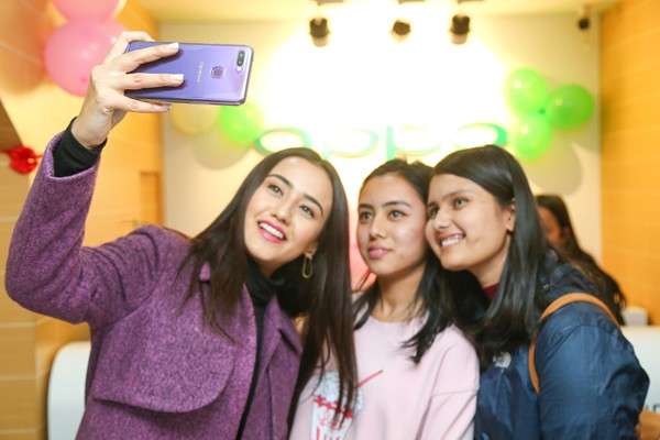 OPPO’s brand ambassador Swastima Khadka (L) takes a selfie during the launch of A7 in the Nepali market on Thursday.  Photo Courtesy: OPPO